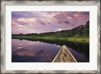Framed Paddling a dugout canoe, Amazon basin, Ecuador