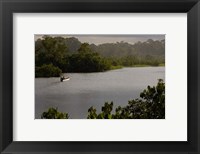 Framed Quichua Indian in Dugout Canoe, Napo River, Amazon Rain Forest, Ecuador