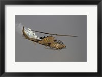 Framed AH-1S Tzefa of the Israeli Air Force dispenses flares