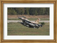 Framed F-16C Barak of the Israeli Air Force taking off from Hatzor Air Force Base