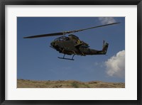 Framed AH-1F Tzefa of the Israeli Air Force flying over the Golan Heights, Israel