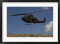 Framed AH-1F Tzefa of the Israeli Air Force flying over the Golan Heights, Israel