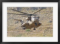 Framed CH-53 Yasur 2000 of the Israeli Air Force landing in the field