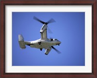 Framed Osprey tiltrotor aircraft in flight