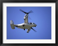 Framed Osprey tiltrotor aircraft in flight