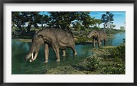 Framed pair of Platybelodon grazing in a shallow stream