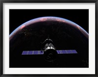 Framed Soyuz TMA-M spacecraft soars over the Atlantic Ocean at sunset