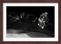 Framed Two Manned Maneuvering Vehicles explore the airless, microgravity environment of a small asteroid