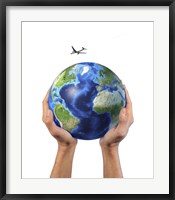 Framed Man's Hands Holding the Planet Earth, with a Jet Aircraft Flying Above