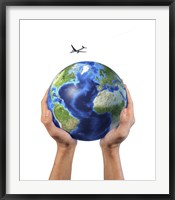 Framed Man's Hands Holding the Planet Earth, with a Jet Aircraft Flying Above