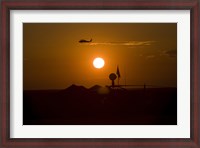 Framed UH-60 Blackhawk Flies Over Camp Speicher Airfield at Sunset