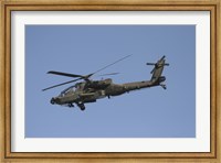 Framed AH-64 Apache in flight over the Baghdad Hotel in central Baghdad, Iraq