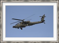 Framed AH-64 Apache in flight over the Baghdad Hotel in central Baghdad, Iraq