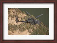 Framed AH-64D Apache Helicopter in Flight