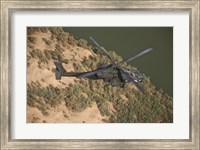 Framed AH-64D Apache Helicopter in Flight
