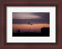 Framed pair of UH-60 Black Hawk helicopters approach their Landing in Baghdad, Iraq