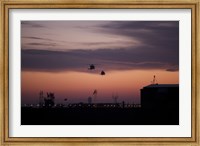 Framed pair of UH-60 Black Hawk helicopters approach their Landing in Baghdad, Iraq