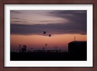 Framed pair of UH-60 Black Hawk helicopters approach their Landing in Baghdad, Iraq