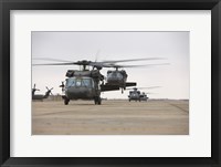 Framed UH-60 Black Hawks taxis out for a mission over northern Iraq