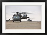 Framed UH-60 Black Hawks taxis out for a mission over northern Iraq