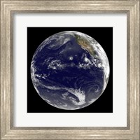 Framed View of Earth Showing Three Tropical Cyclones in the Pacific Ocean