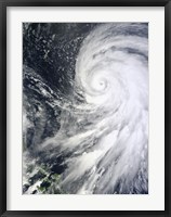 Framed Typhoon Bolaven northeast of the Philippines