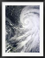 Framed Typhoon Bolaven northeast of the Philippines