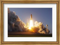 Framed Space Shuttle Discovery lifts off from its Launch Pad at Kennedy Space Center, Florida