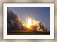 Framed Space Shuttle Discovery lifts off from its Launch Pad at Kennedy Space Center, Florida