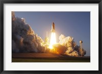 Framed Space Shuttle Discovery lifts off from its Launch Pad at Kennedy Space Center, Florida