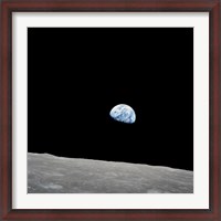 Framed Earth Rising Above the Lunar Horizon