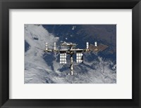 Framed International Space Station Backgropped by a Blue and White Earth