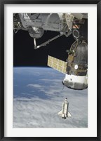 Framed Space Shuttle Endeavour, a Soyuz Spacecraft, and the International Space Station
