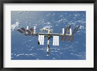 Framed International Space Station Backdropped by a Blue and White Part of Earth