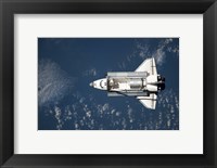 Framed Aerial view of Space Shuttle Discovery over Earth