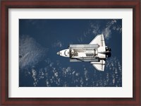 Framed Aerial view of Space Shuttle Discovery over Earth