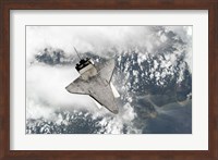 Framed Underside of Space Shuttle Discovery as the Shuttle approaches the International Space Station