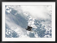 Framed Rear view of the Three main Engines of Space Shuttle Discovery as the Shuttle approaches the International Space Station