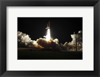 Framed Space shuttle Discovery lifts off from Launch Pad 39A at Kennedy Space Center in Florida, on the STS-131 mission