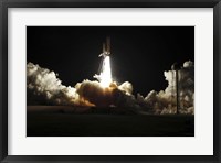 Framed Space shuttle Discovery lifts off from Launch Pad 39A at Kennedy Space Center in Florida, on the STS-131 mission