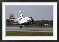 Framed With Drag Chute Unfurled, Space Shuttle Discovery Lands on Runway 33