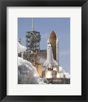 Framed Atlantis' Twin Solid Rocket Boosters Ignite to Propel the Spacecraft into Orbit at Kennedy's Space Center