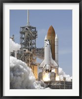 Framed Atlantis' Twin Solid Rocket Boosters Ignite to Propel the Spacecraft into Orbit at Kennedy's Space Center