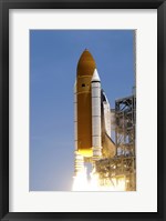 Framed Atlantis' Twin Solid Rocket Boosters Ignite to Propel the Spacecraft Off Kennedy Space Center's Launch Pad 39A