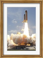 Framed Space shuttle Atlantis lifts off from Kennedy Space Center's Launch Pad 39A into orbit