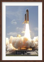 Framed Space shuttle Atlantis lifts off from Kennedy Space Center's Launch Pad 39A into orbit
