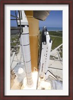 Framed Space shuttle Atlantis lifts off from Kennedy Space Center's Launch Pad