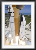 Framed Space shuttle Atlantis lifts off from Kennedy Space Center's Launch Pad