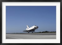 Framed Space shuttle Atlantis approaching Runway 33 at the Kennedy Space Center in Florida