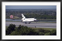 Framed With Drag Chute Unfurled, Space Shuttle Discovery Lands on Runway 33 at Kennedy Space Center in Florida